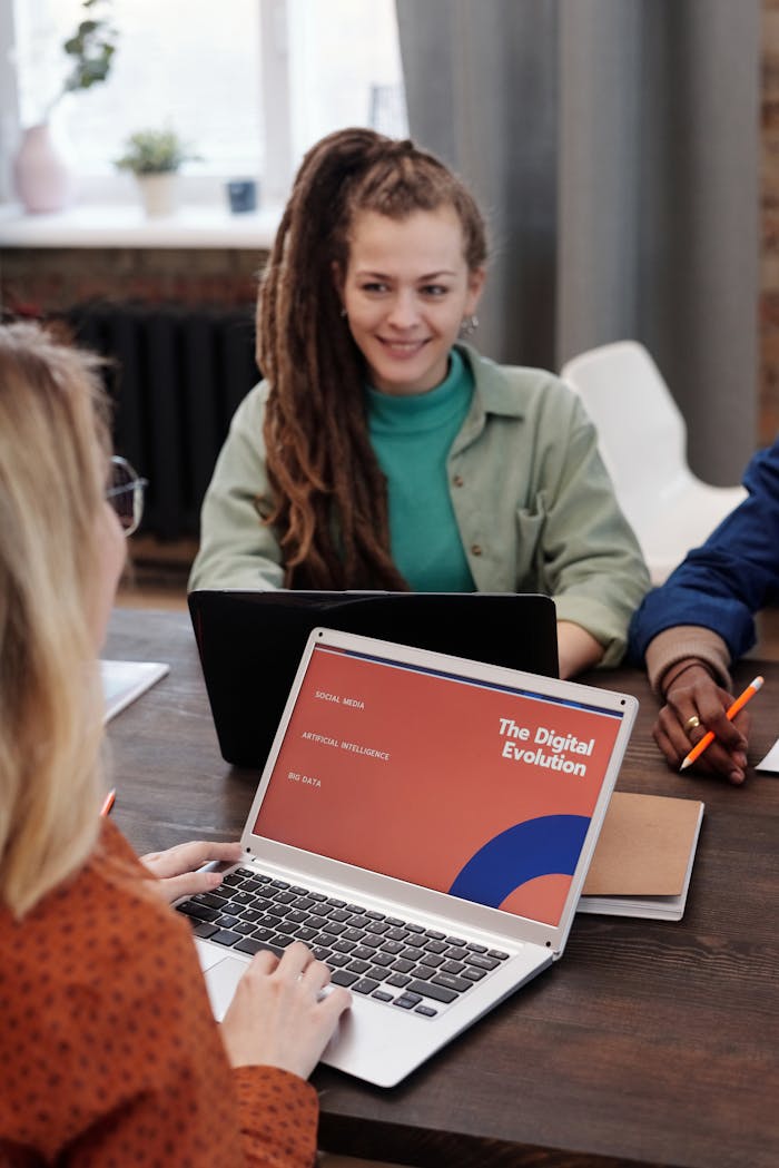 Home Team members engaged in a collaborative discussion about digital evolution during a meeting.